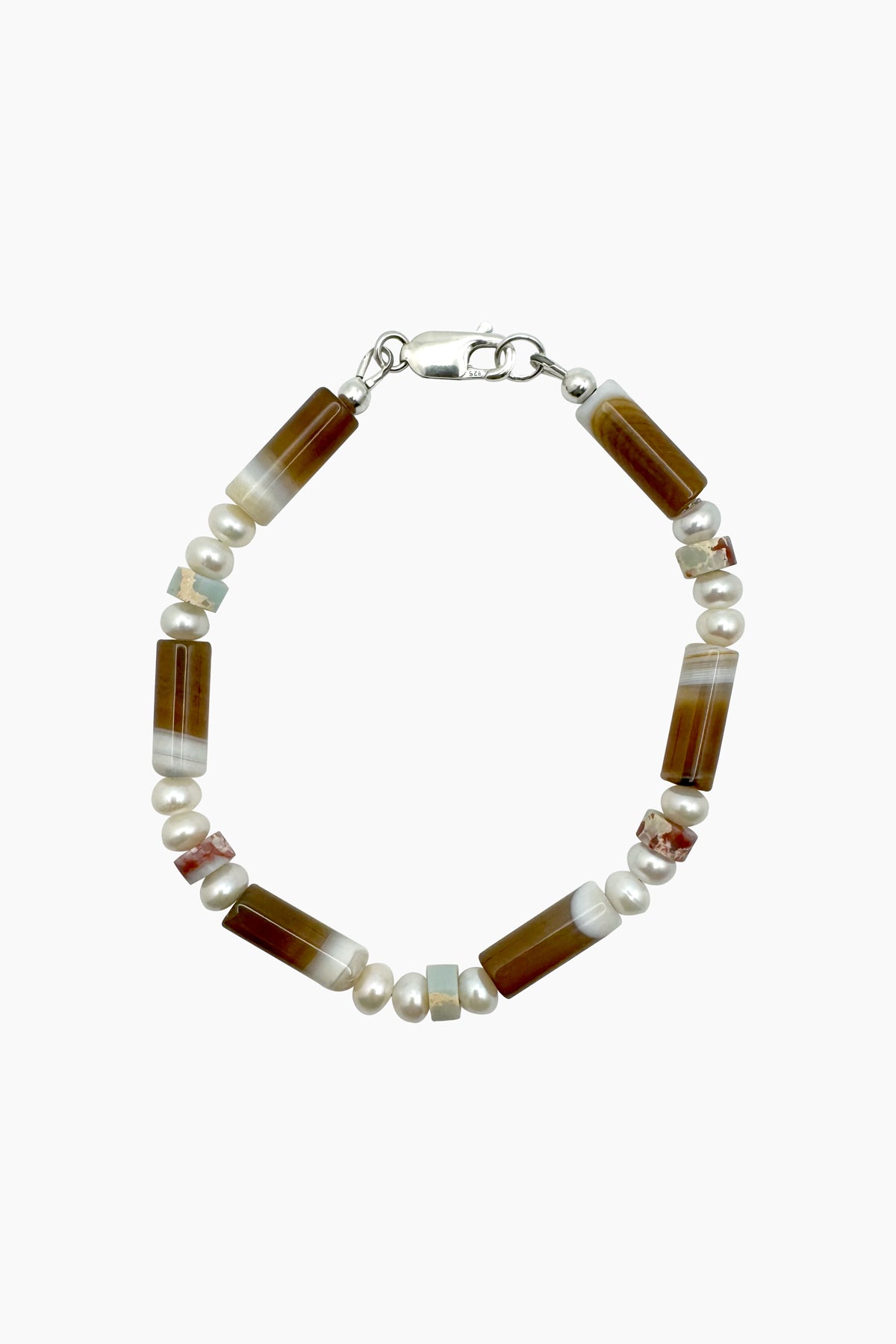 Close-up of the Bennie Bracelet, handcrafted with agate, jasper, and freshwater baroque pearls, with a sterling silver lobster clasp.