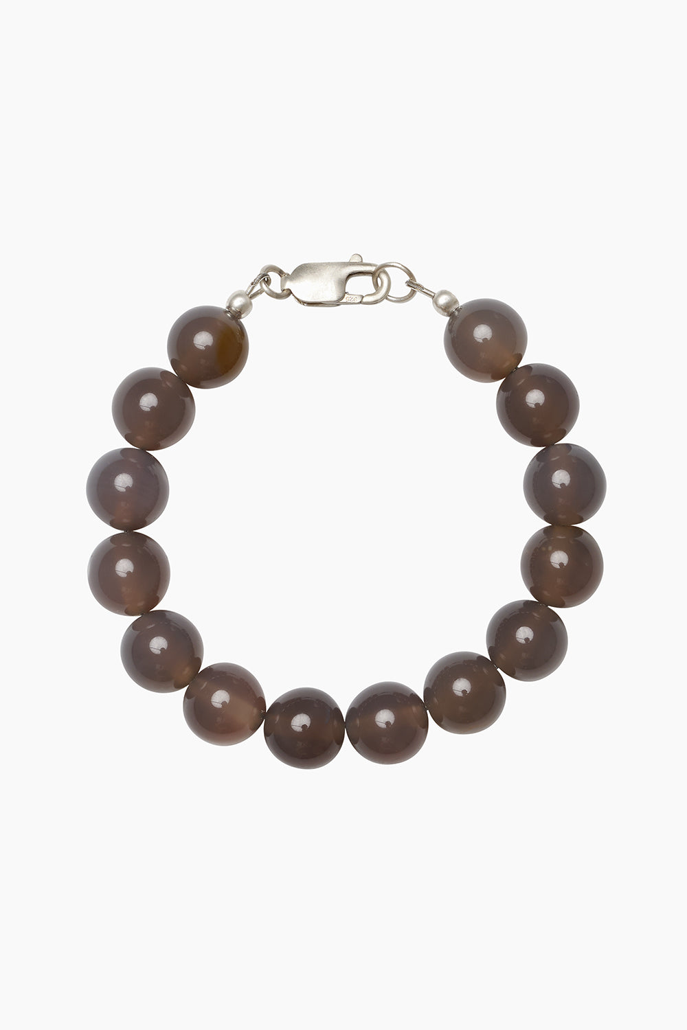 The Cinder Bracelet — beaded bracelet in grey agate, photographed on neutral background.