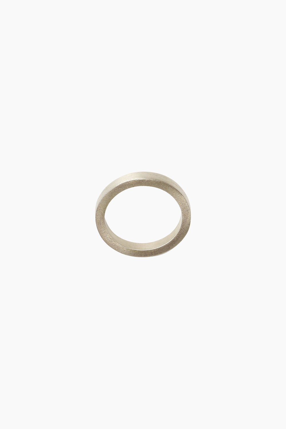 Minimalist sterling silver stacking ring with a slim band design, photographed against a white background.