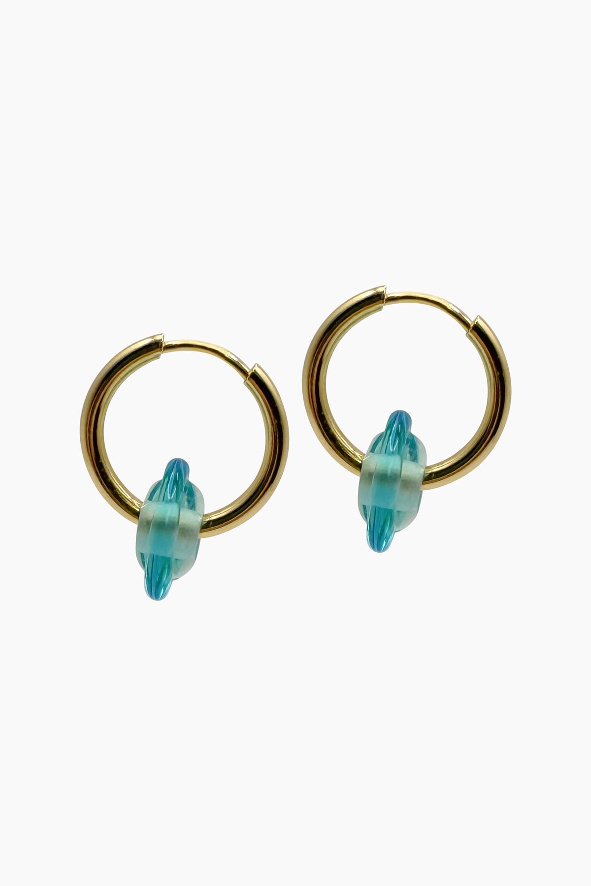 Side angle of the Keeley I Earrings showing the dimensional shape of the turquoise handblown glass beads and the sculptural 18K gold-plated hoops. Nature-inspired summer earrings.