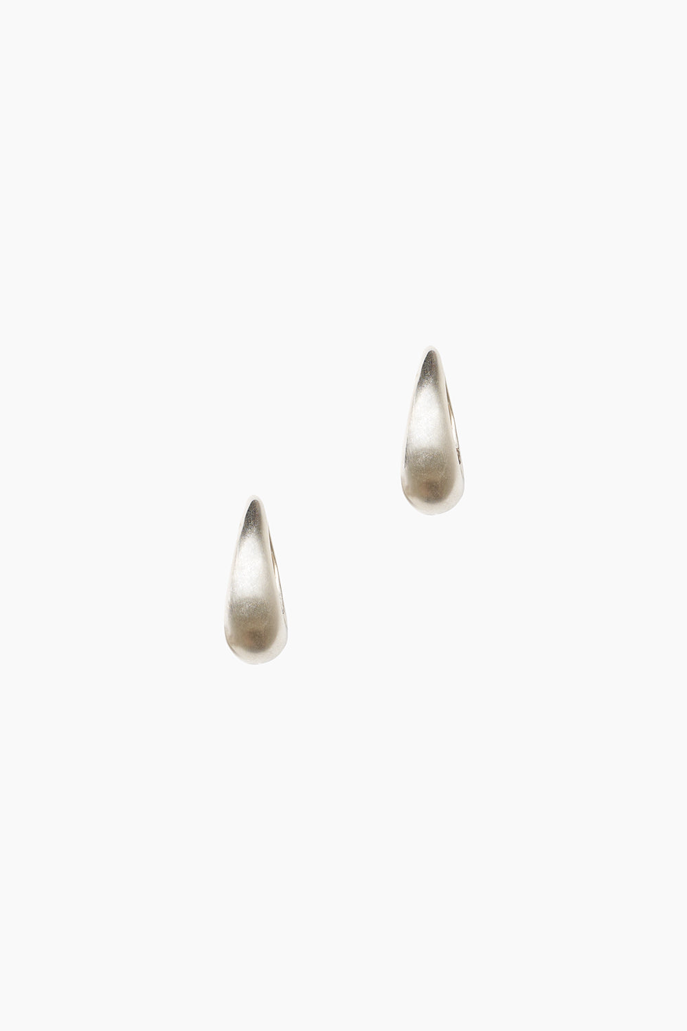 Front view of the Keeper Earrings — matte sterling silver elongated hoop earrings with a teardrop-inspired design.