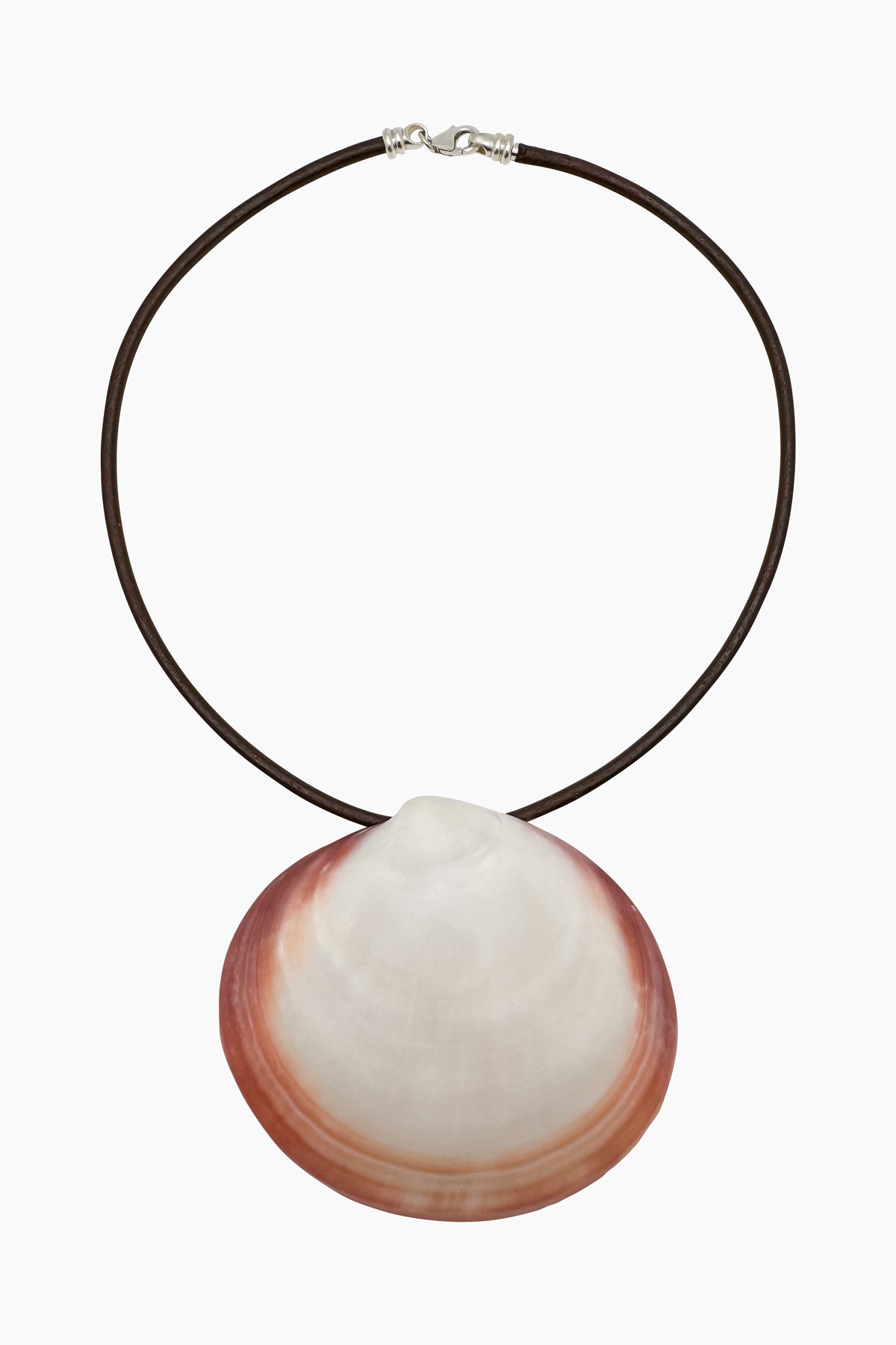 Product photo of the Oceane Necklace. A brown leather with a sterling silver clasp and a tiger clam pendant in a soft pink hue. Soft colors, organic shapes, natural textures - ocean-inspired jewelry found in nature. Handmade in Los Angeles.