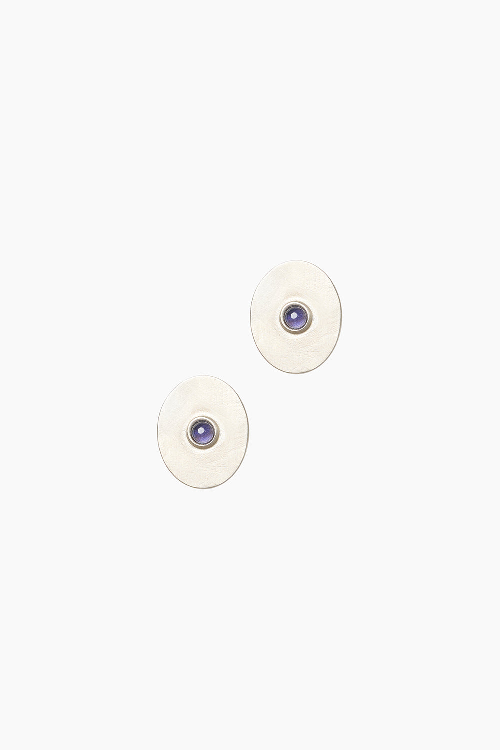 Front view of the Oracle Earrings — vintage-inspired sterling silver medallion studs with central iolite stone.