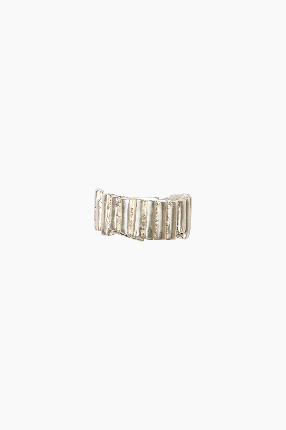 The Relic Ring photographed against a white background, showing its uneven vertical ridges and handcrafted, textured design in sterling silver.