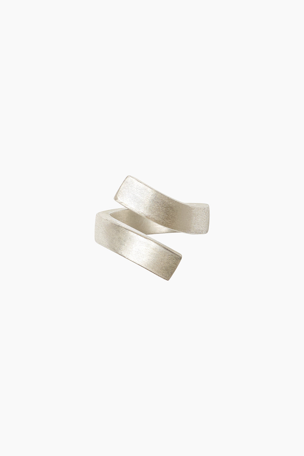 Sterling silver bypass ring with sculptural negative space design, modern minimalist Vigil Ring jewelry photographed on white background.
