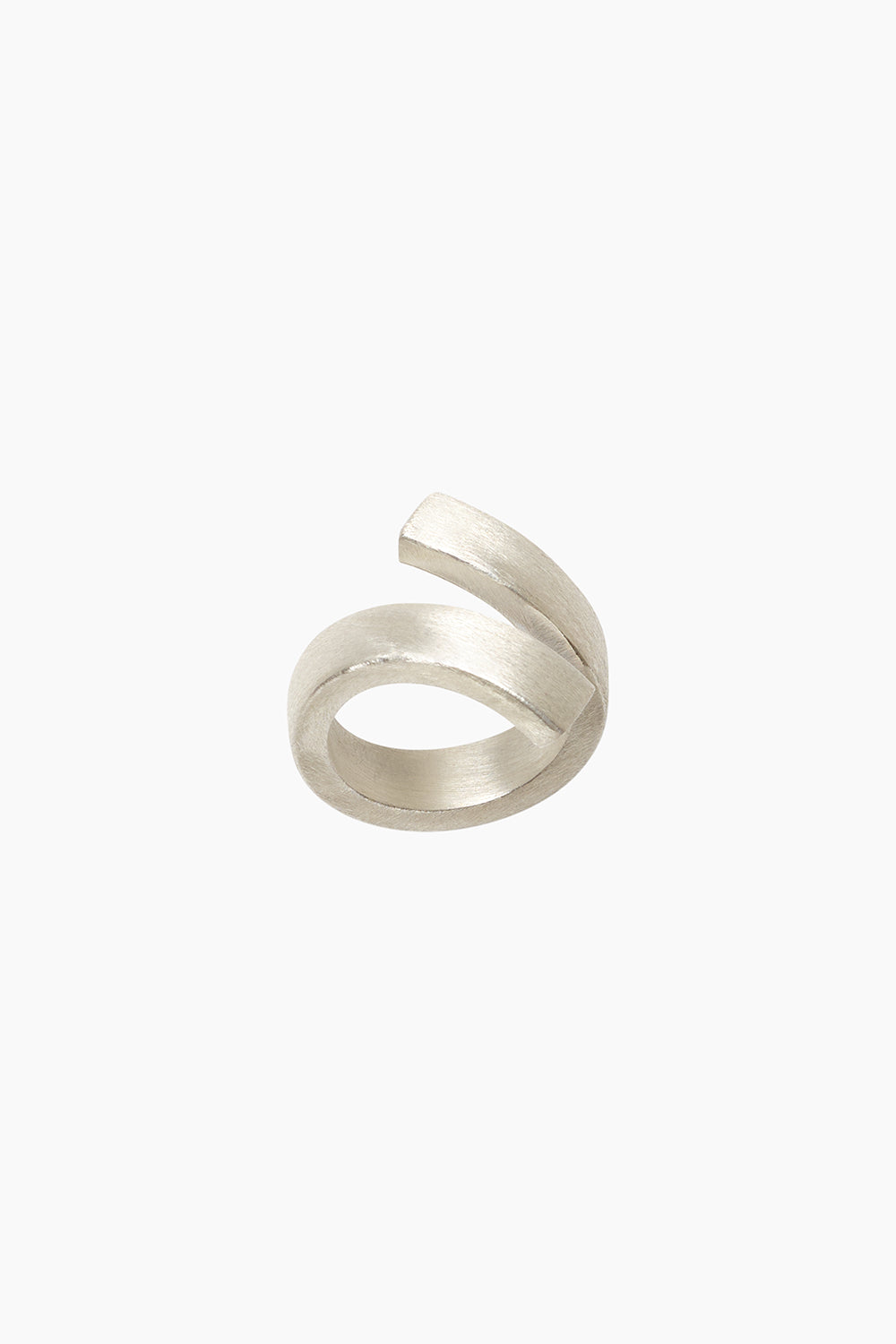 Contemporary sterling silver bypass ring shown from the side, highlighting open negative space and wide sculptural band design.