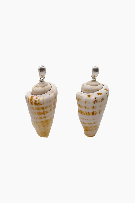 Silver dome huggie earrings with chunky cone-shaped seashell drops, offering a sculptural, ocean-inspired design.