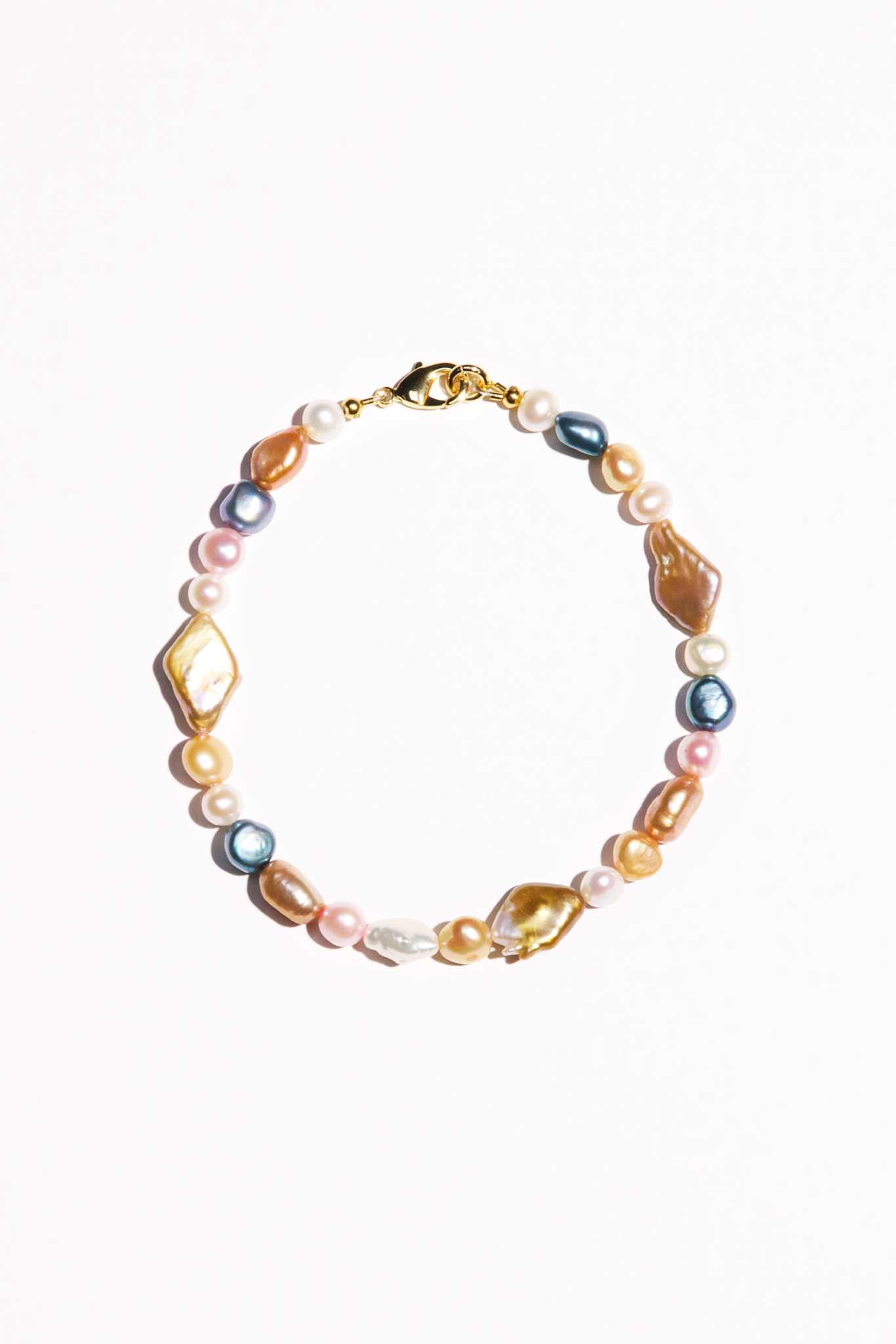 Multicolored anklet featuring a variety of freshwater baroque and AAA-quality pearls.  