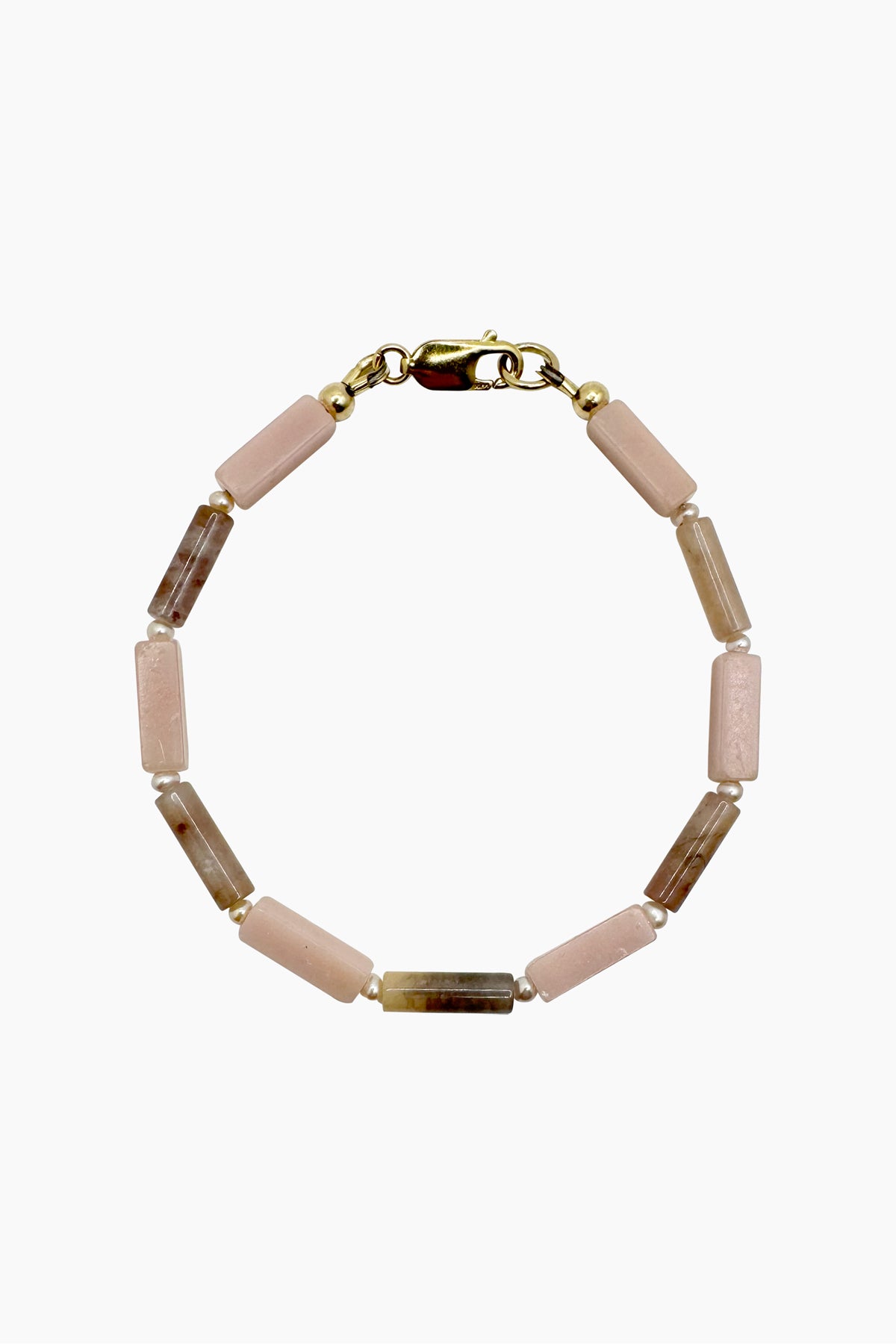 lose-up of the Gia Bracelet, a handmade beaded bracelet featuring pink opal, phantom quartz, and freshwater pearls. A soft, feminine design with natural gemstones and organic textures.