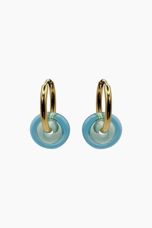 Front view of the Keeley I Earrings featuring handblown turquoise glass disk beads on 18K gold-plated stainless steel hoops. Vibrant, ocean-inspired fun jewelry.