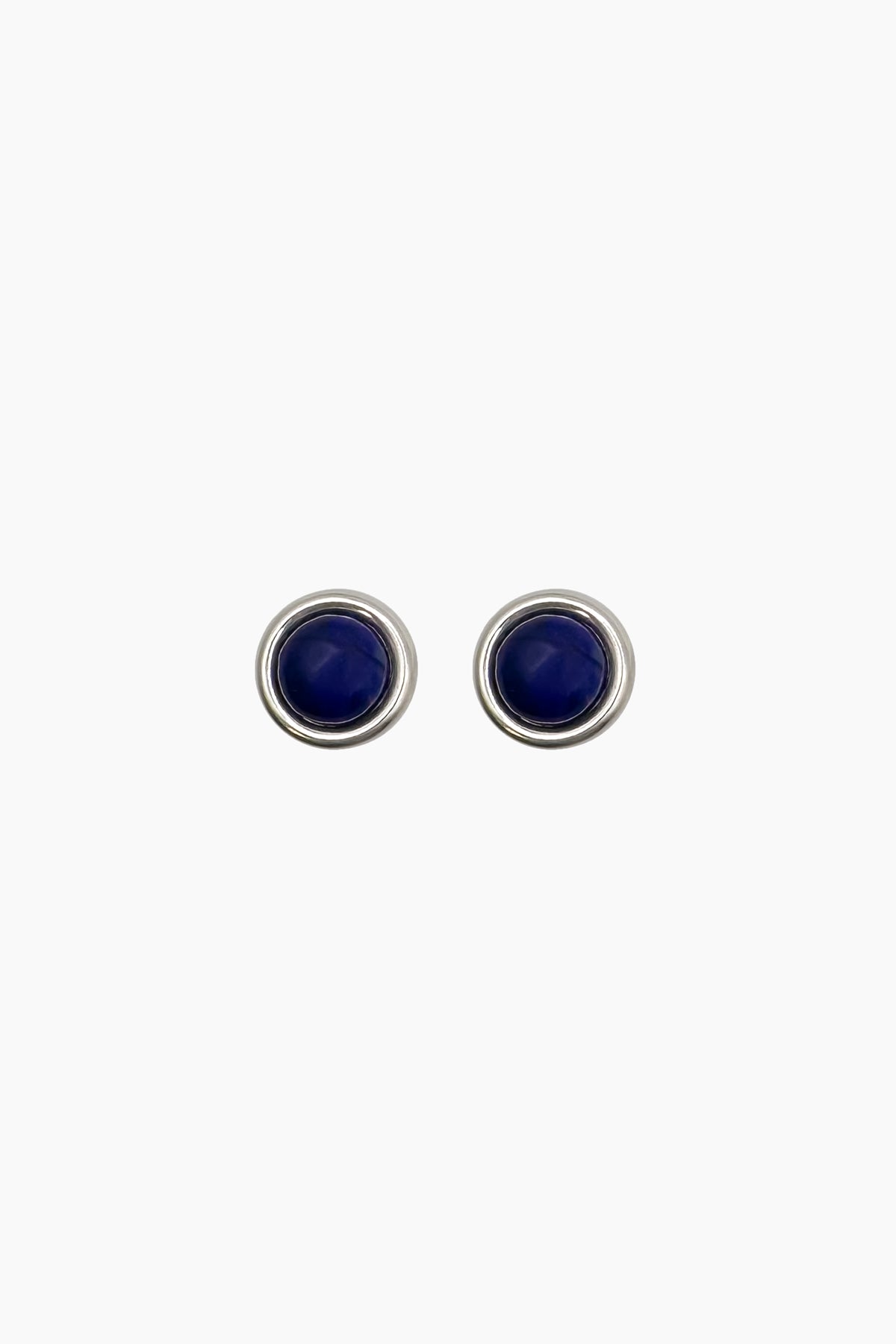 Product photo of the Mabel Earrings. Blue lapis stud earrings set in a thick sterling silver bezel. 