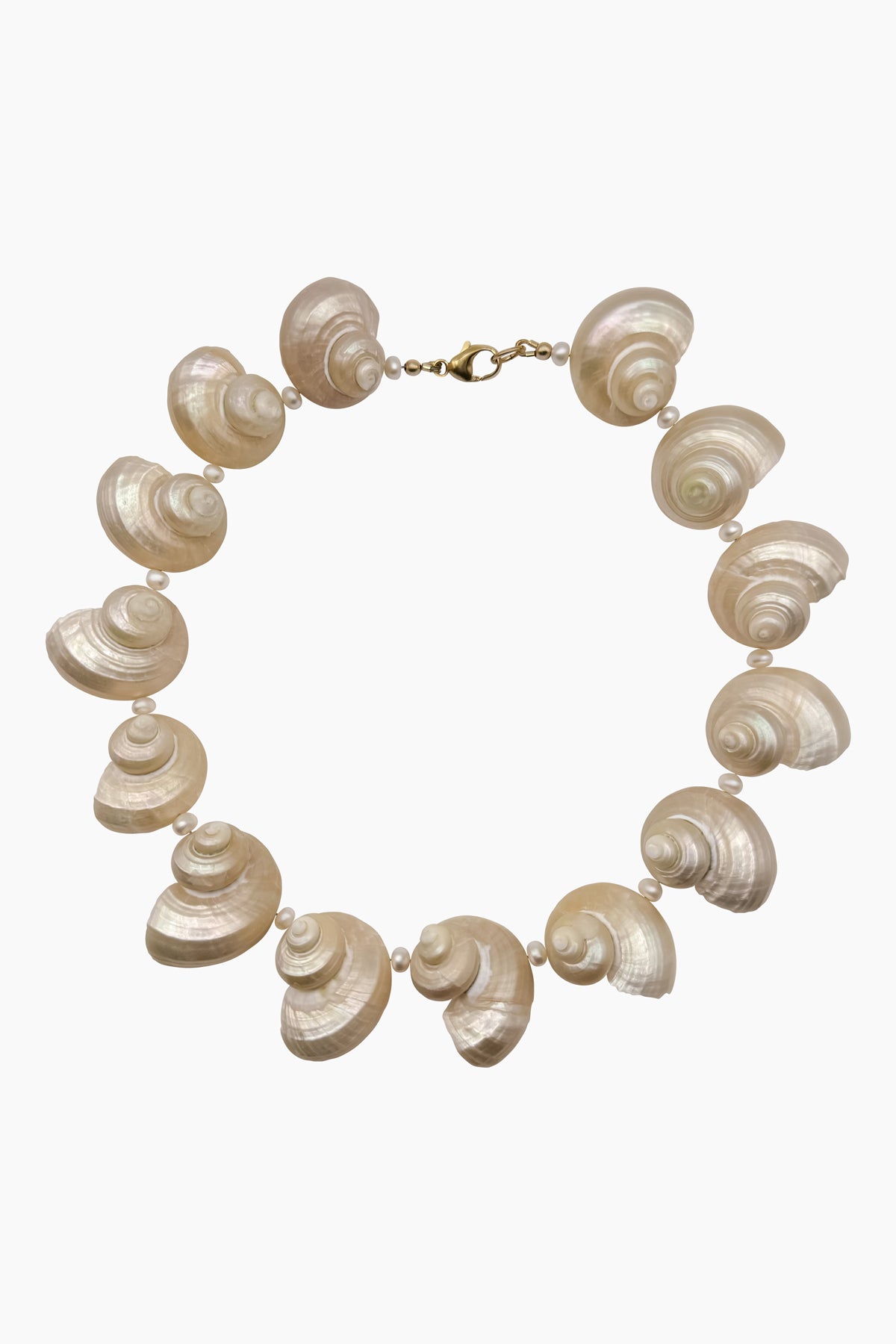 The Mer Necklace, a modern heirloom crafted from turbo seashells and freshwater pearls. A sustainable, ocean-inspired statement piece, handmade with meticulous care.
