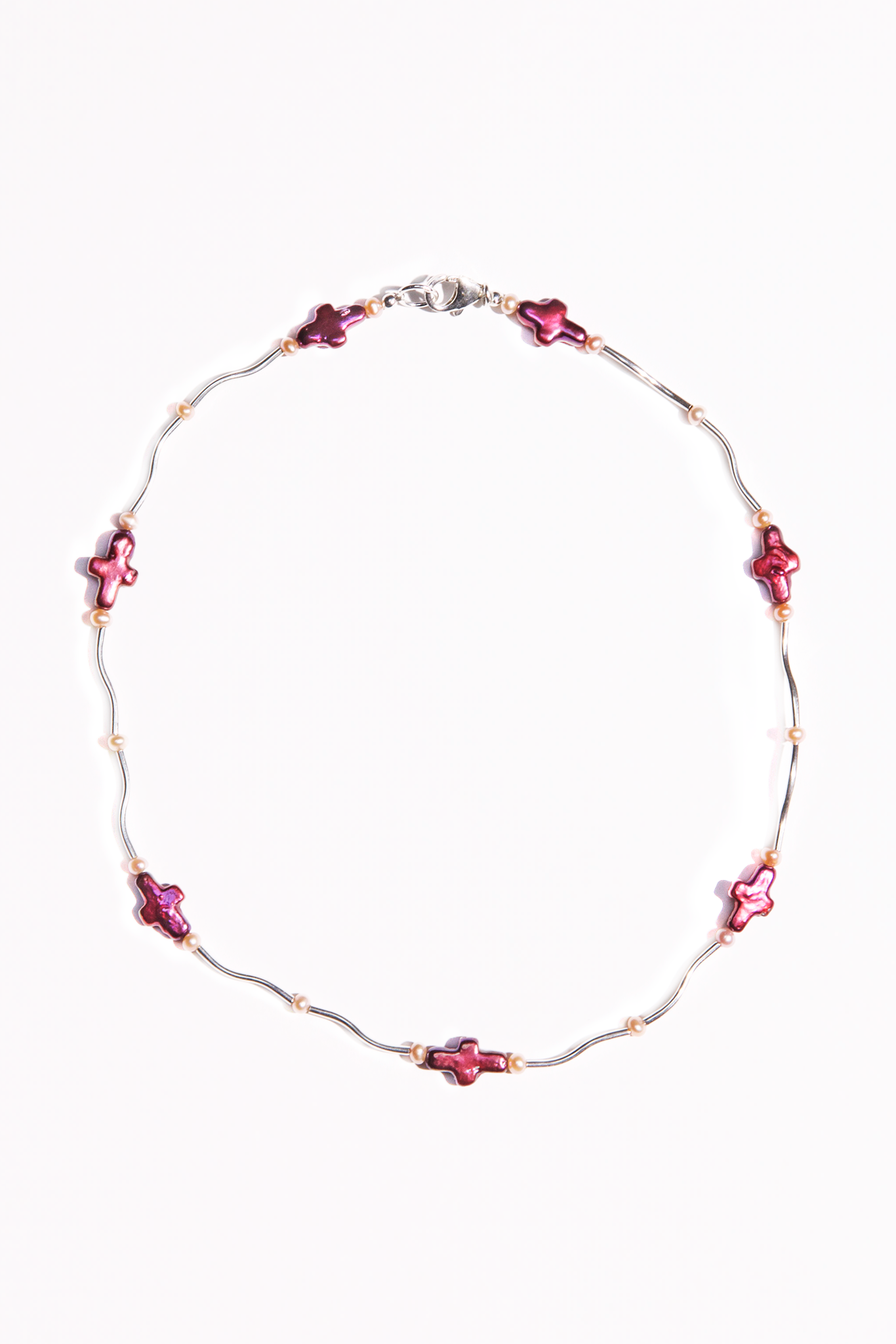 Dainty necklace featuring solid .925 Sterling Silver curved tubes, cherry red freshwater pearl crosses, and AAA-quality freshwater pearls.