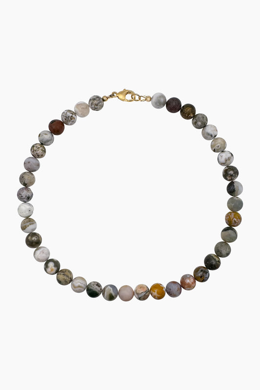 Product photo of the Pascal Necklace, featuring rounded Ocean Jasper beads with swirling patterns and vibrant colors—each inspired by the movement of the sea.
