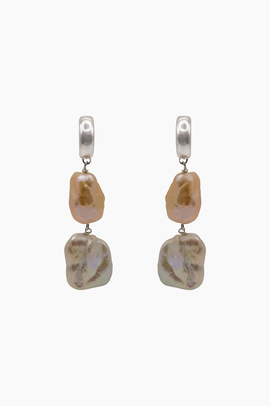 Frontal view of Siren Earrings featuring tiered freshwater baroque and keshi pearls, hanging delicately from 3/4-closed sterling silver hoops.