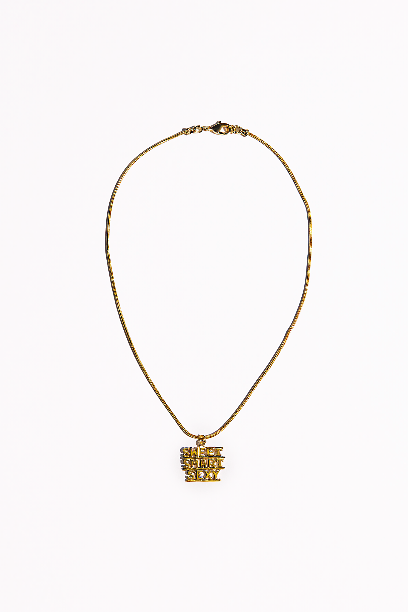 Gold necklace featuring a charm that says Sweet Smart Sexy