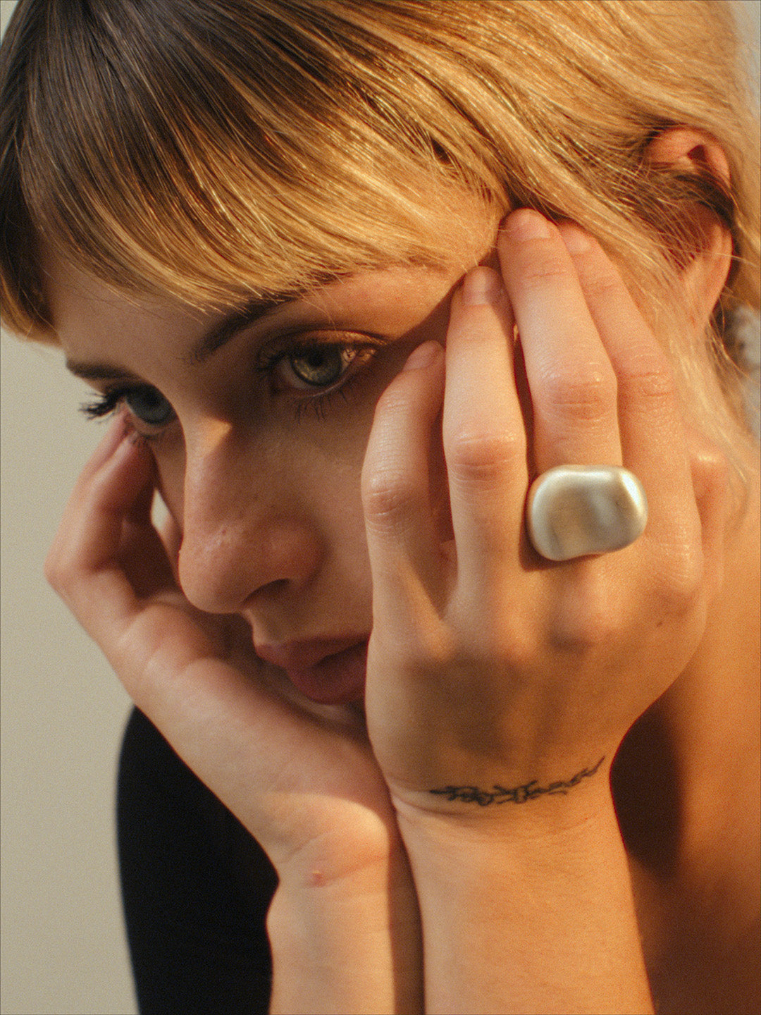 The Vessel Ring by cocoatemyshoes — an organic and tactile silver ring with a soft matte finish, captured in a natural portrait emphasizing its sculptural form and dome silhouette.